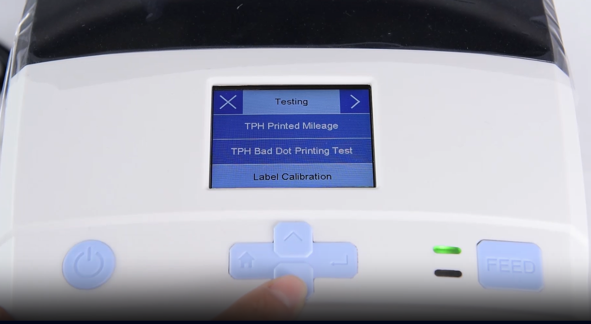 Ett close-up of a machine's digital interface showing a testing menu.
